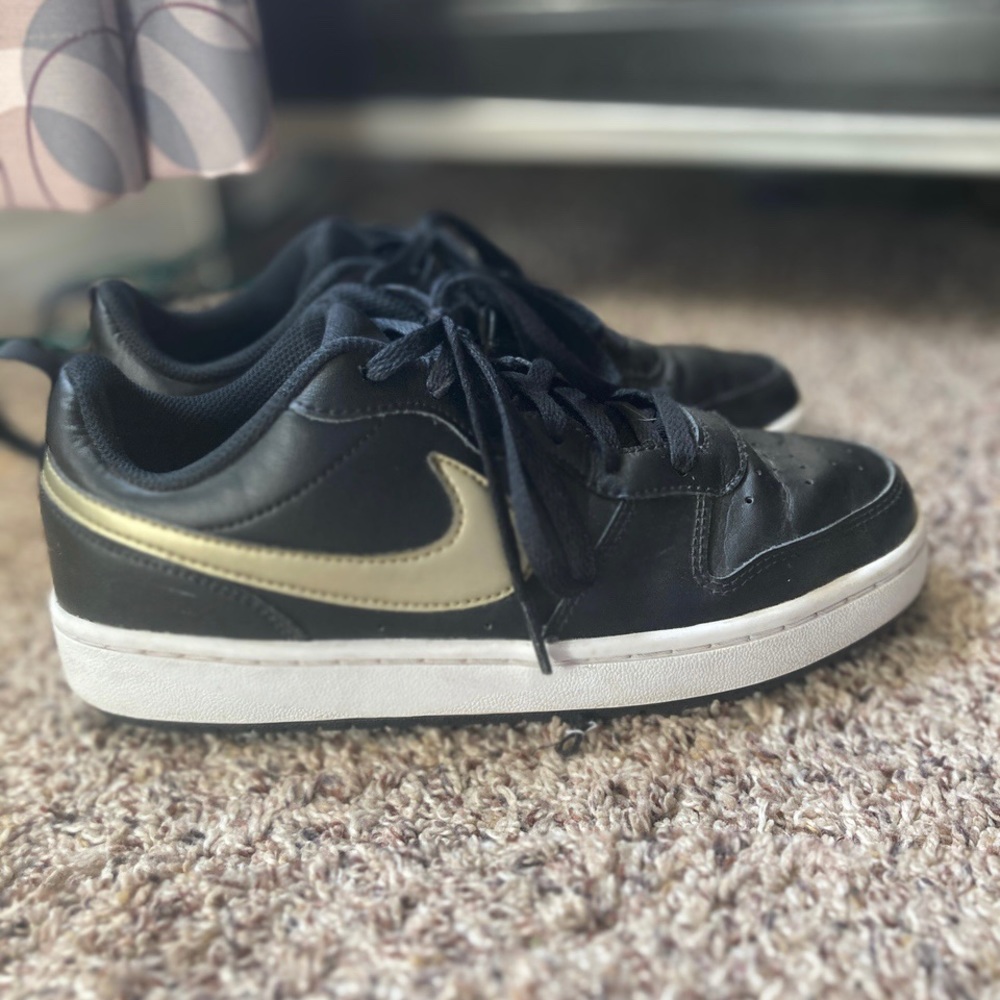 black air force 1 with gold nike sign